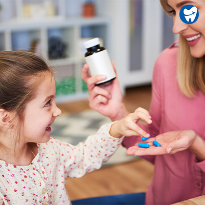 Mom giving medicines to the child