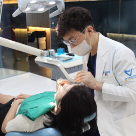 Vix Dental Clinic, Ho Chi Minh City, Dr. Hwan performing surgery on his patient