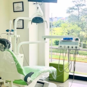 clinic interior with a green dental chair