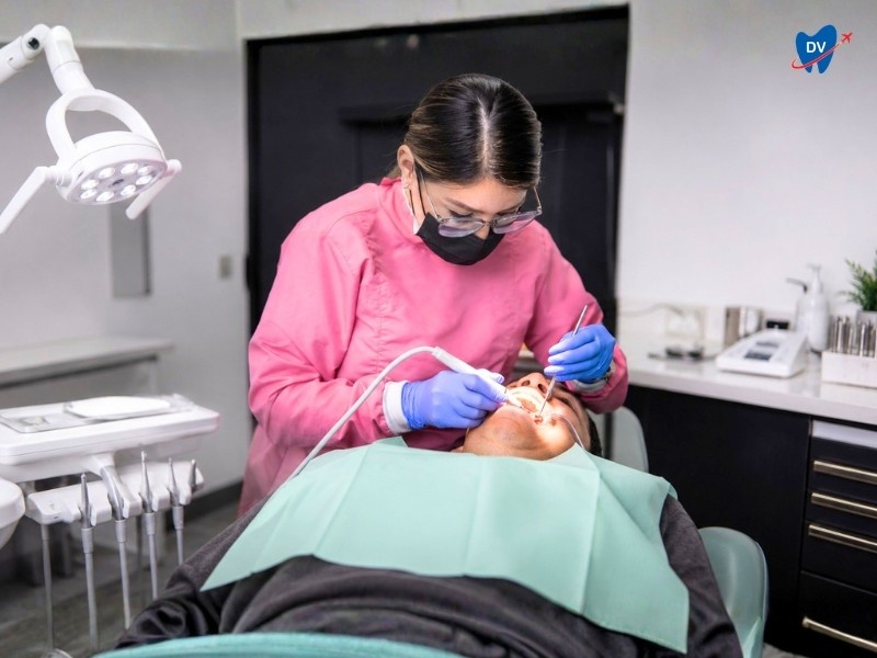 this is an image of a female dentist operating on a patient in Dental Mate dental clinic in Nuevo Laredo, Mexico