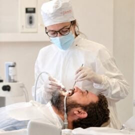 Dentist treating a patient inside the clinic